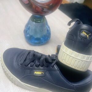 Puma Women’s Black and Gold Sneakers